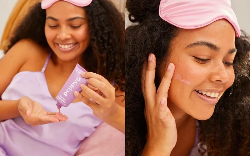 A woman in a purple singlet wearing an eye mask on her forehead using the Peppy Co. All-In-One Sleeping Mask.