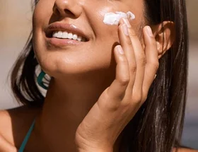 Moisturiser with SPF woman on beach