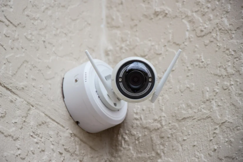 A surveillance camera mounted on a wall