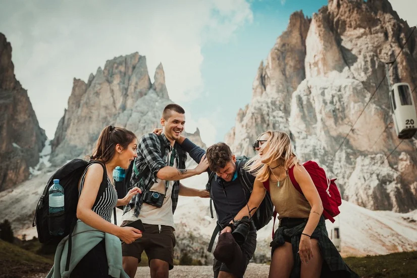 A group of happy friends at a mountain range.
