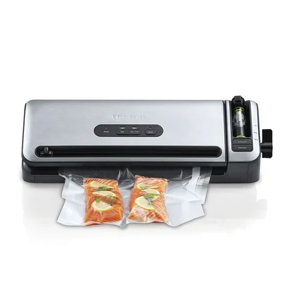 A Foodsaver vacuum sealer being used to seal soups and stews in a kitchen.