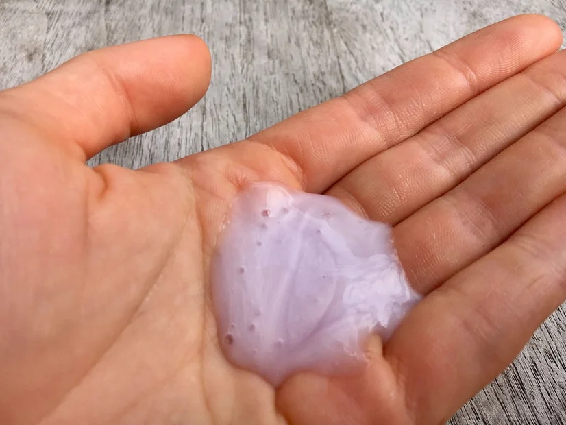 Some of the Kevin Murphy Angel Wash shampoo in a woman's hand.