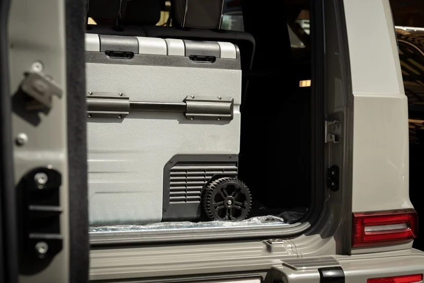 A portable fridge in a vehicle.
