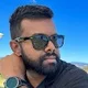 Sujan J.