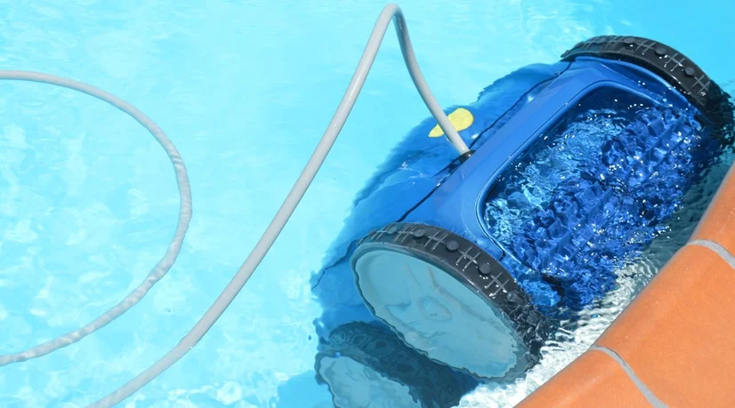 A robot_pool_cleaner_in a home swimming_pool.