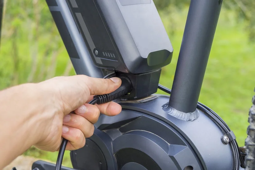 close up of e-bike battery being recharged