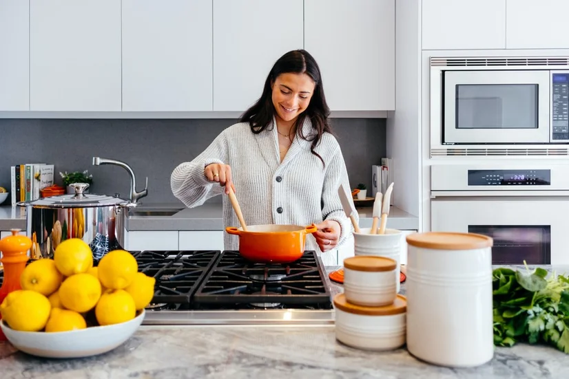 Woman cooking in kitchen