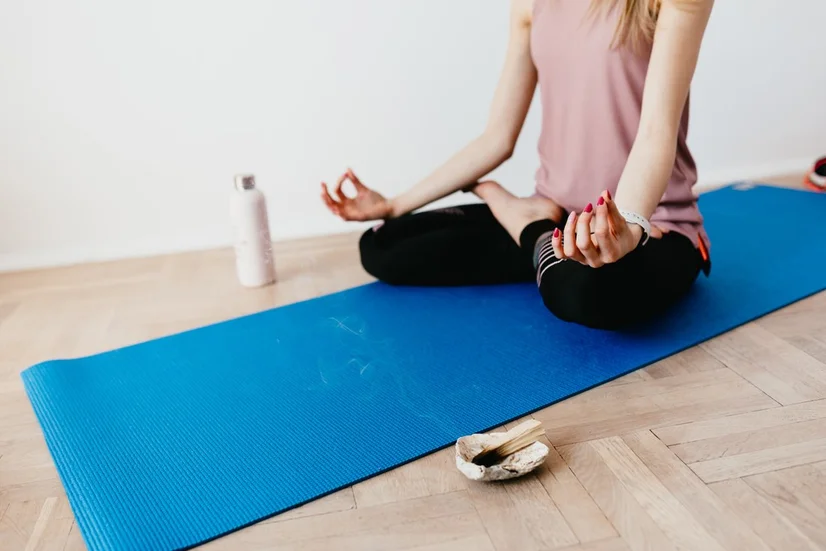 Woman doing yoga and relaxing