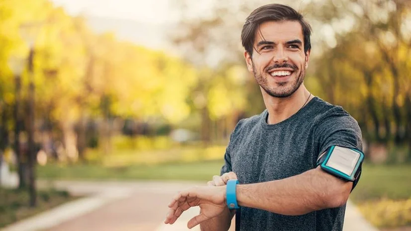 Happy man after finishing a jogging session outdoors