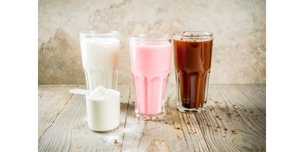 three flavoured weight loss shakes, vanilla, strawberry and chocolate with scoop of powder